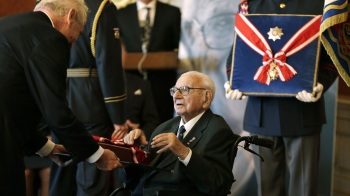 Czech Republic's President Milos Zeman (left) decorates Nicholas Winton with the Czech Republic's highest decoration, The Order of the White Lion, in Prague, on Oct. 28, 2014. Winton, a British citizen who died last year at age 106, saved 669 mostly Jewish children from the Nazis by transporting them out of Prague to Great Britain in 1939.